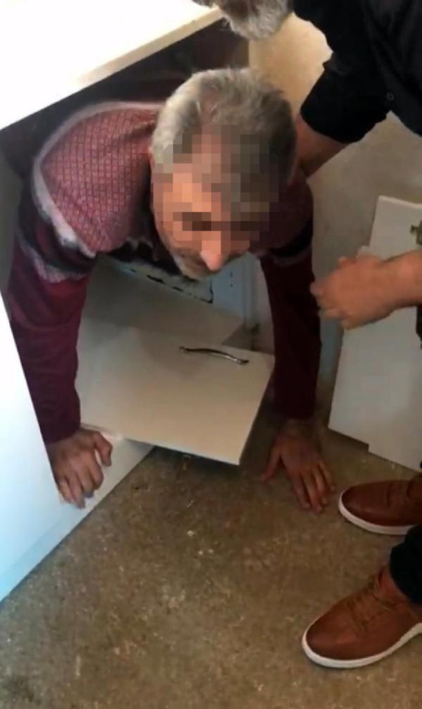 Cinayet şüphelisi, mutfak dolabındaki gizli bölmede yakalandı